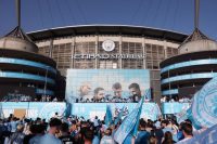 Man City fans line streets to celebrate cup double in final farewell to Pep Guardiola